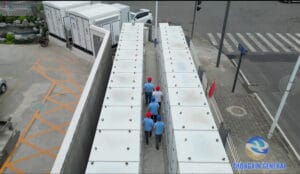 Aerial view of the Chengdu Xinjin Fangxin 10MW/h user-side battery storage project with technician inspecting the battery container aisle