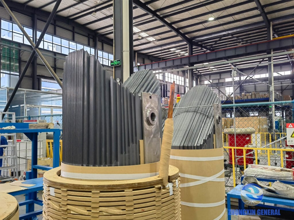 Transformer core inserted into windings during 12500kVA transformer assembly