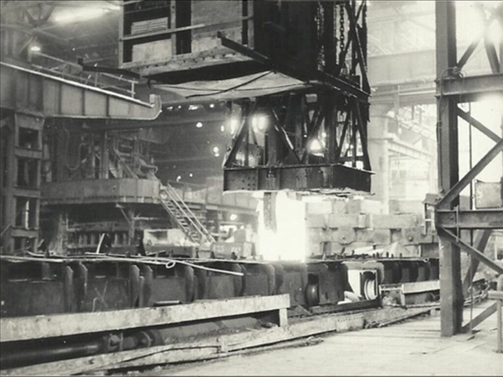 1930s British hot-rolling mill workshop producing early hot-rolled silicon steel