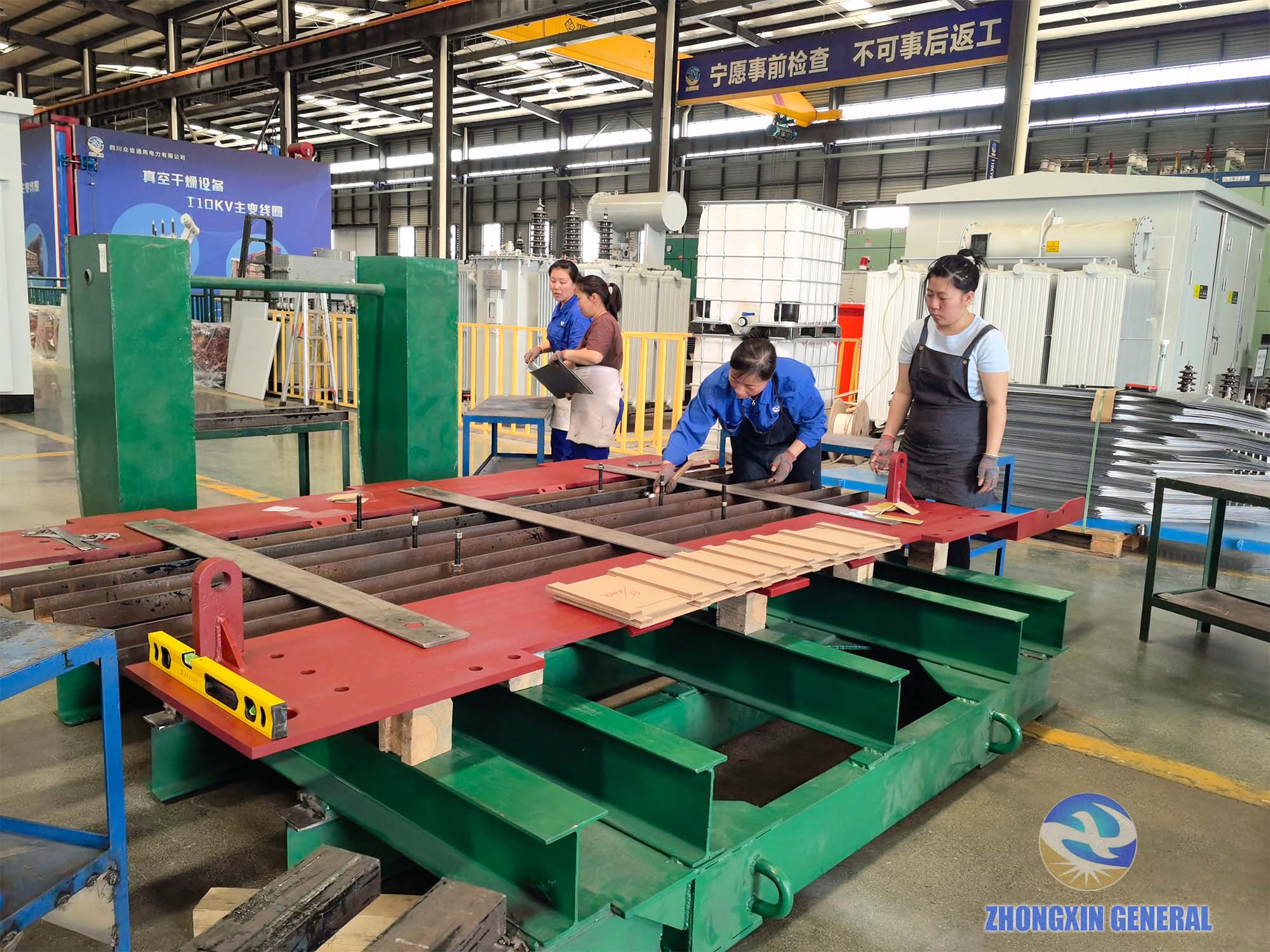 Technicians calibrating core lamination stacking on 31500kVA transformer with level and wrench — Zhongxin General