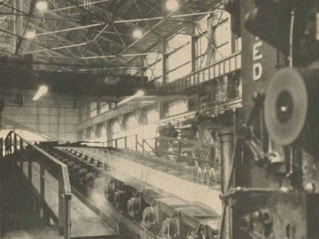 1930 slab rolling mill workshop matching the era of early grain-oriented silicon steel development