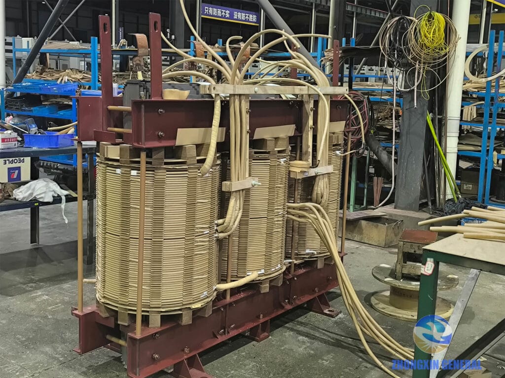 6300 kVA transformer winding assembly complete, lead connection and insulation processing in progress — Zhongxin General