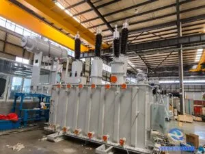 Completed 8000kVA SZ20-8000/120 OLTC transformer front view — HV bushings and conservator tank Zhongxin General