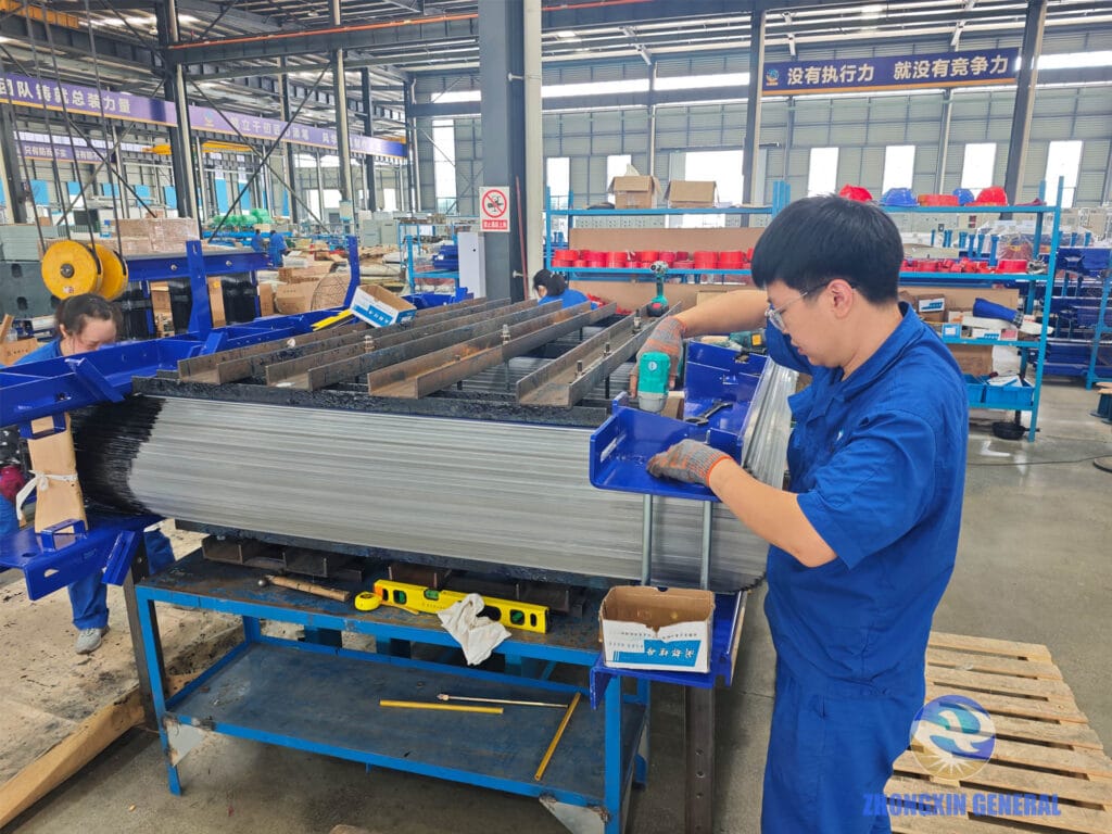 Technician tightening blue clamping fixture on transformer core