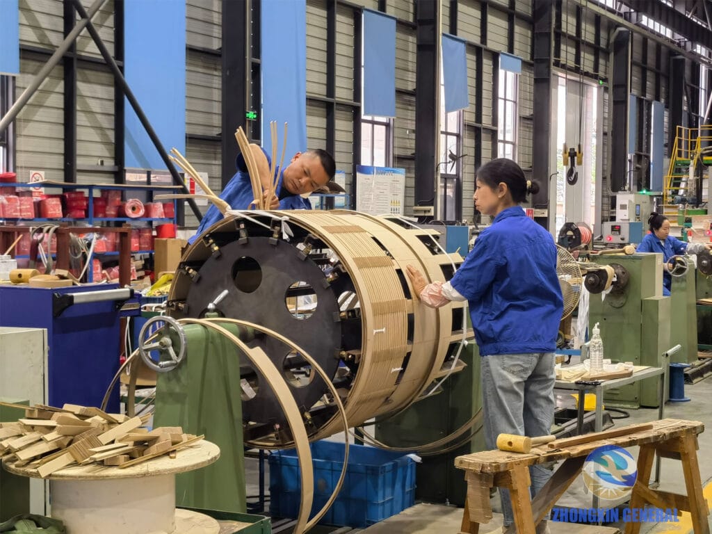 Technicians winding an 8000kVA oil-immersed transformer coil