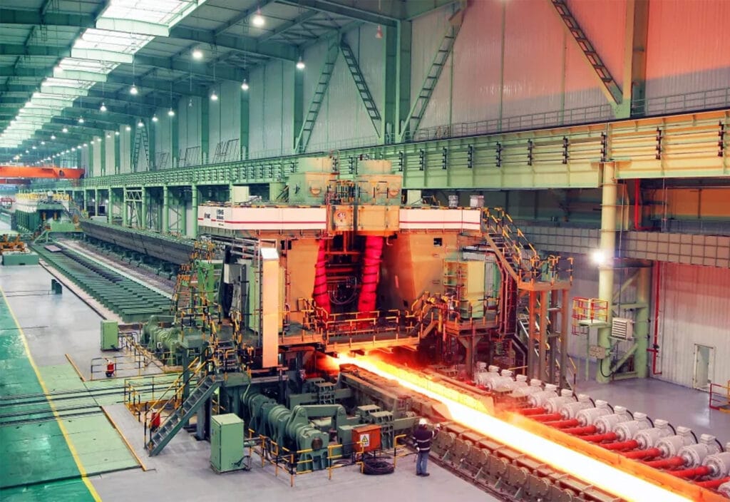 Red-hot steel billet moving along the hot rolling line at Angang Steel's Bayuquan plant