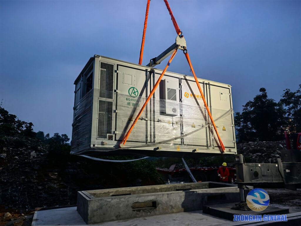 Crane lifting a 5.015MWh battery container into position on site