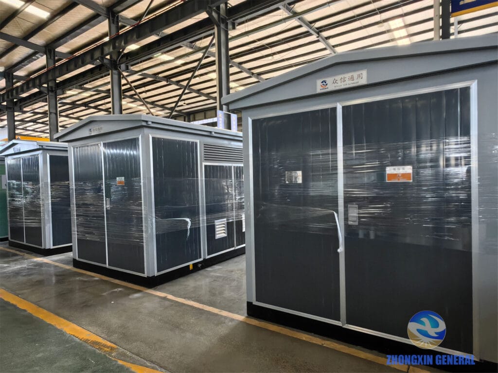 Three box-type substations strapped and secured for shipment