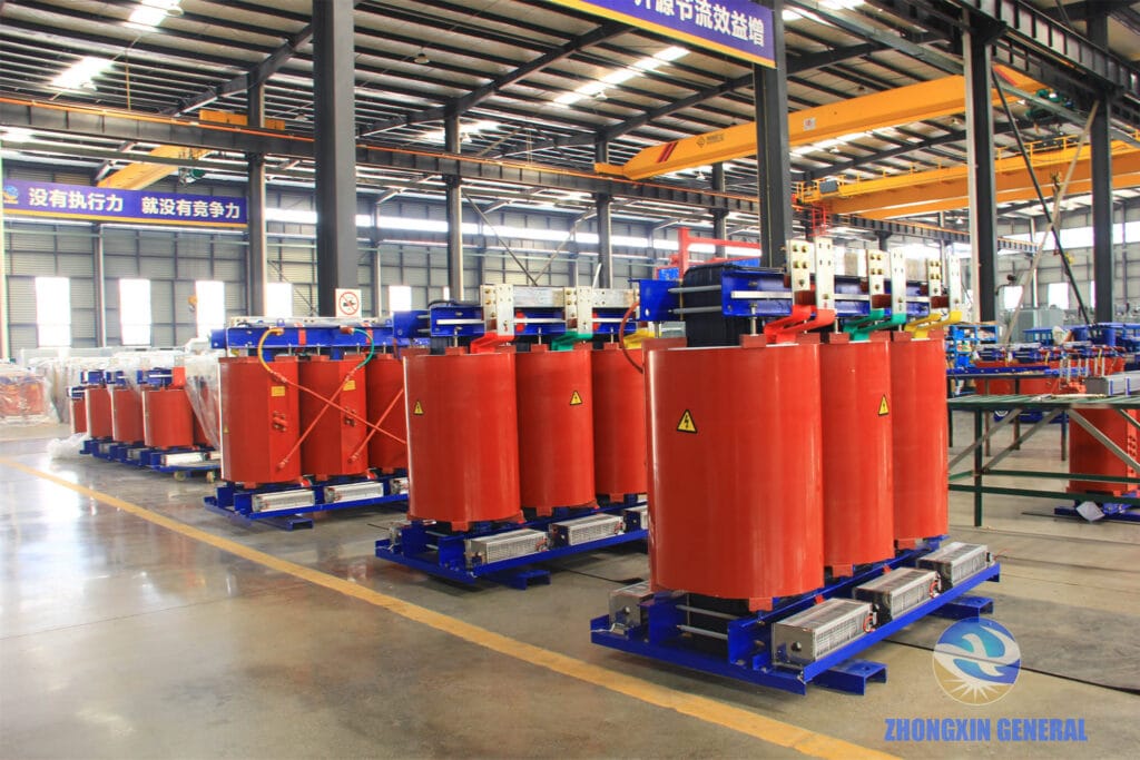 Row of completed resin-cast dry-type transformers in storage yard