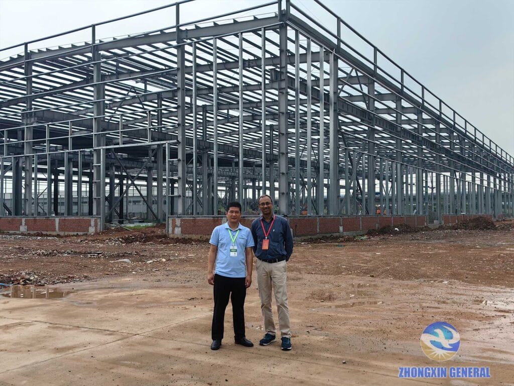 Export manager Zhou and Indian client at the Boruian New Energy construction site