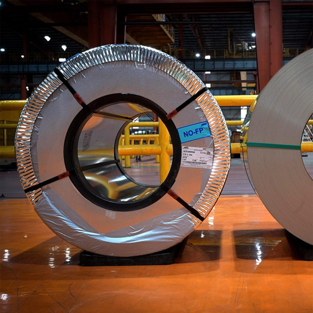 Finished grain-oriented silicon steel coils stored at the JSW-JFE joint venture plant in India