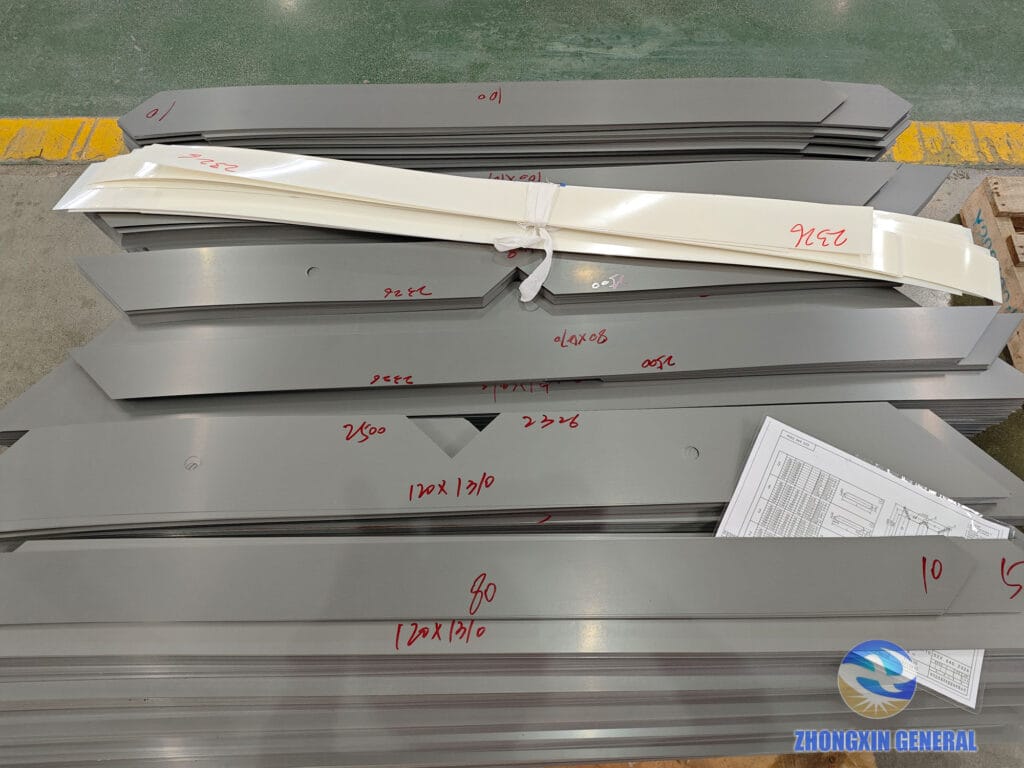 Cut silicon steel sheets labeled with dimension size for core assembly