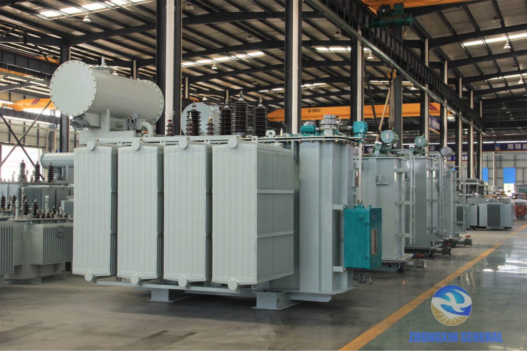 Row of oil-immersed distribution transformers ready for dispatch