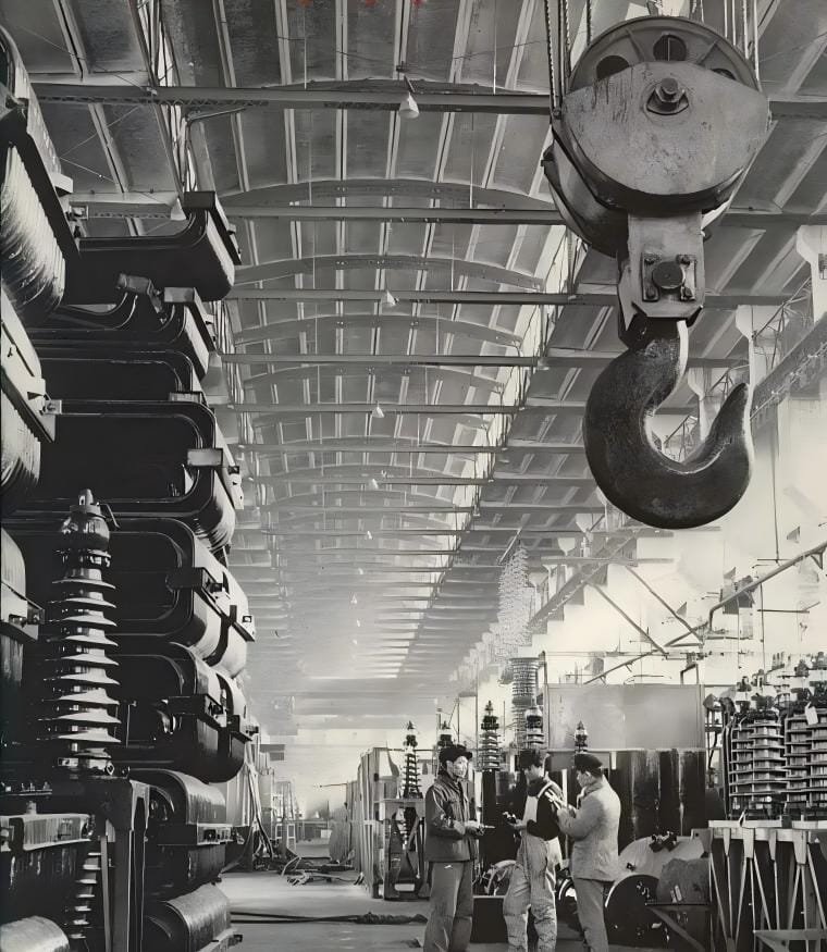 Technicians discussing production inside Shenyang Transformer Works