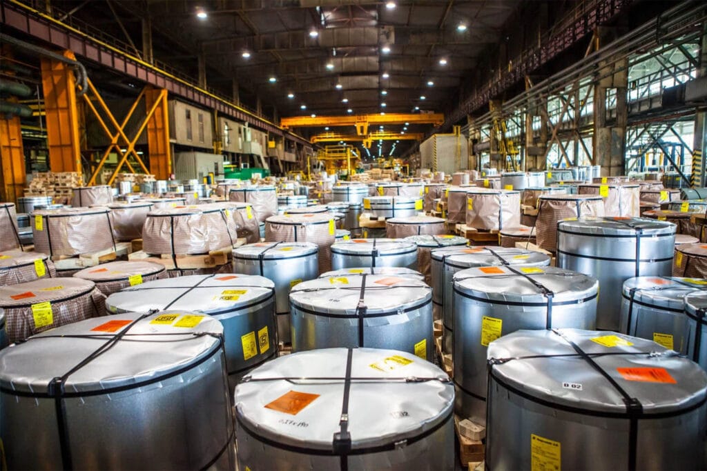 Wrapped and protected grain-oriented silicon steel coils stacked in Stalprodukt's Polish warehouse