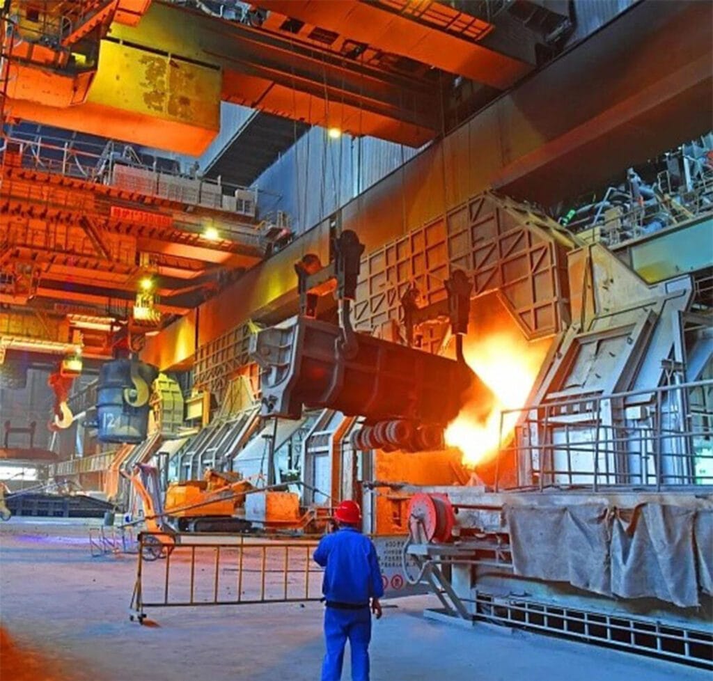Overhead crane transporting a ladle of molten steel inside Shanxi Taigang's melt shop