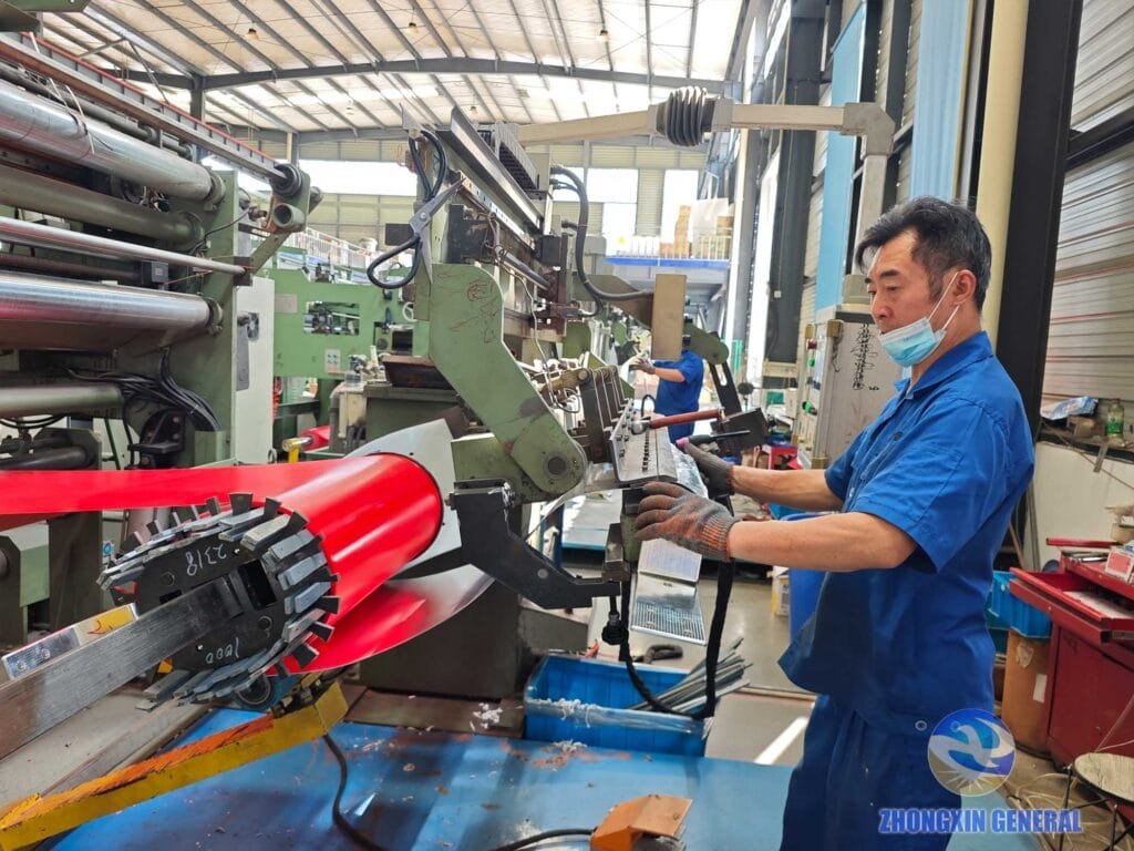Worker connects winding coil with copper busbar accurately