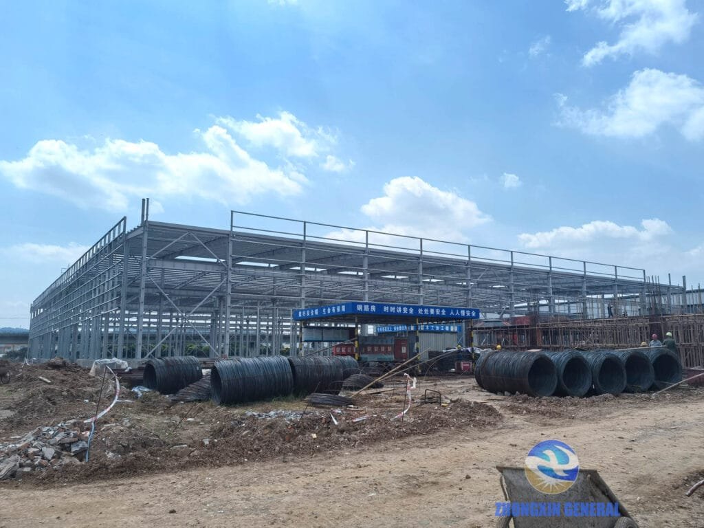 Left-side workshop building and main office building under construction at Boruian New Energy storage base, Xinjin Chengdu, June 29 2026