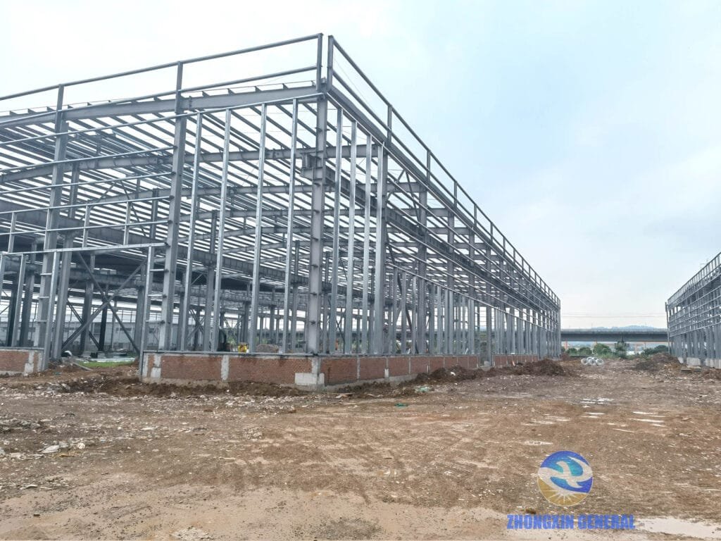 Central axis view of both workshop buildings under construction at Boruian New Energy 5 GWh storage manufacturing base, Xinjin Chengdu, July 10 2026