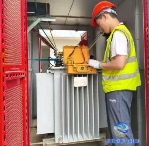 Engineer tests electrical performance of oil immersed transformer in box substation
