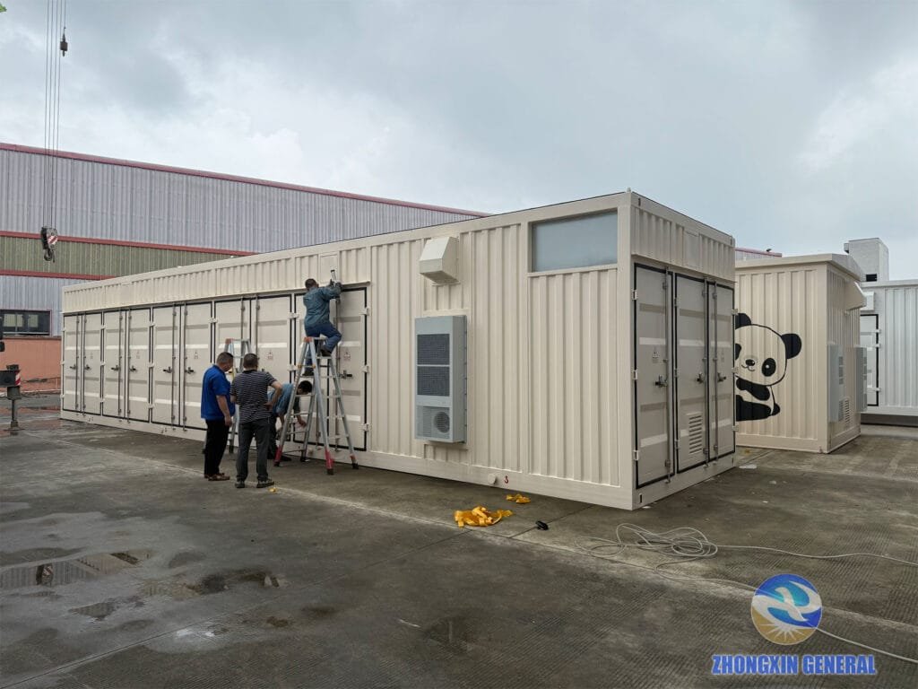 Workers wiping down the exterior of a prefabricated cabin and checking door seal integrity
