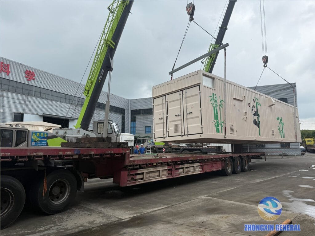 Prefabricated cabin lifted off the ground and being positioned onto the loading truck