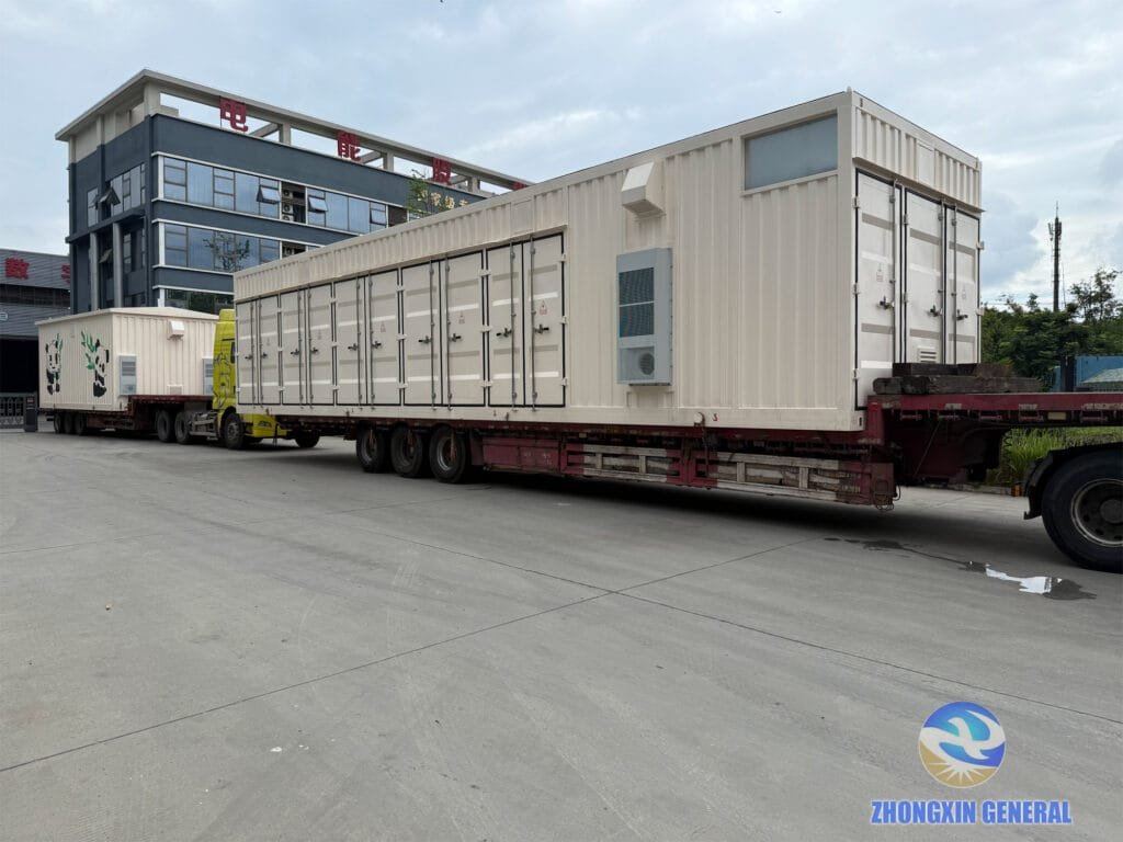 Fully loaded and secured trucks ready to depart with prefabricated switchgear cabins