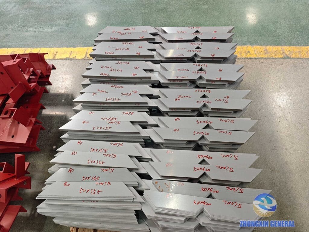Silicon steel sheets stored in partitioned workshop zones with labels