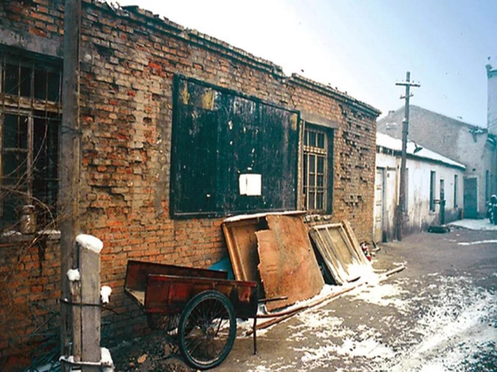 The original Changji Transformer Factory, predecessor of TBEA, showing its dilapidated workshop buildings in the late 1980s