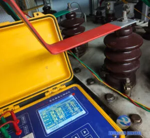 transformer turns‑ratio tester conducting three‑phase ratio measurement on‑site