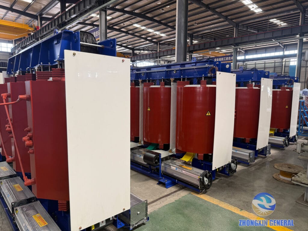 Completed 5250 kVA 37kV/690V cast-resin dry-type transformers lined up in the ZHONGXIN factory for a battery energy storage project