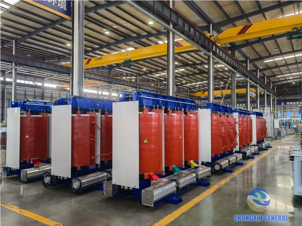 20 units of 5250 kVA 37kV 690V cast resin dry-type transformers lined up in factory production hall with overhead crane