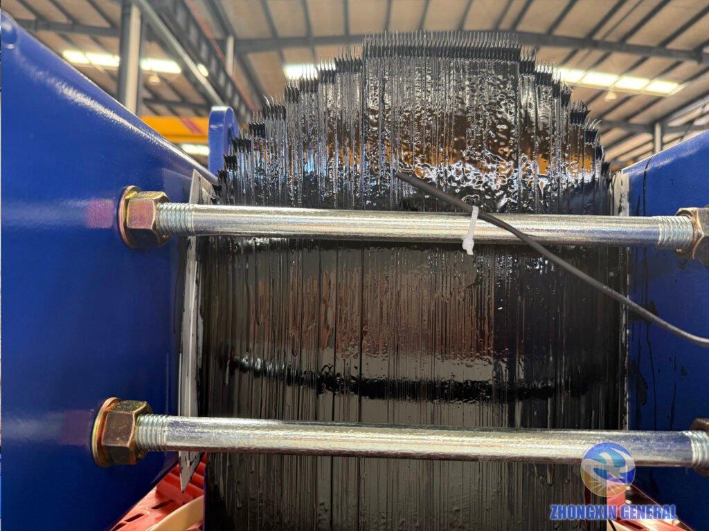 close-up of transformer core silicon steel laminations with hand-brushed black insulating varnish finish