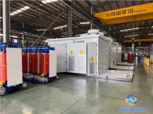 ZHONGXIN General factory floor with completed 5250 kVA dry-type transformers (left) and prefabricated cabin substations (right) being prepared for shipment