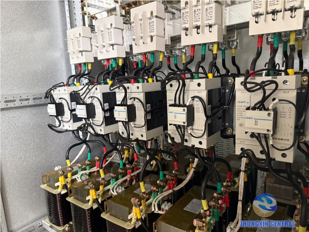Close-up of capacitor bank switching module with CHNT CJ19 contactors and NT00 fuse links in prefabricated substation