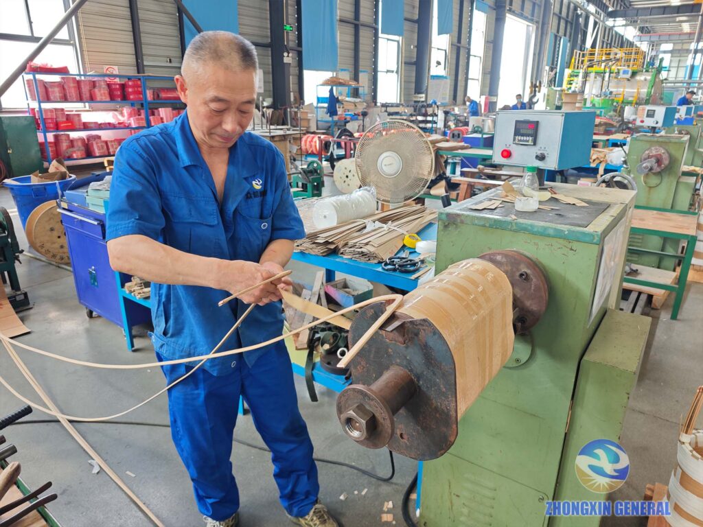 Technician winding high‑voltage and low‑voltage winding for S11‑M‑250/10 250 kVA oil‑immersed transformer