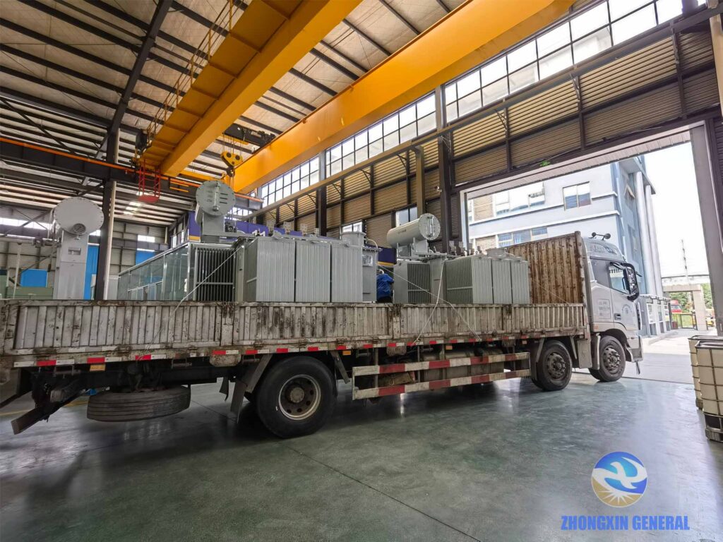 Batch of 4000 kVA oil-immersed transformers loaded on trucks awaiting dispatch at factory yard