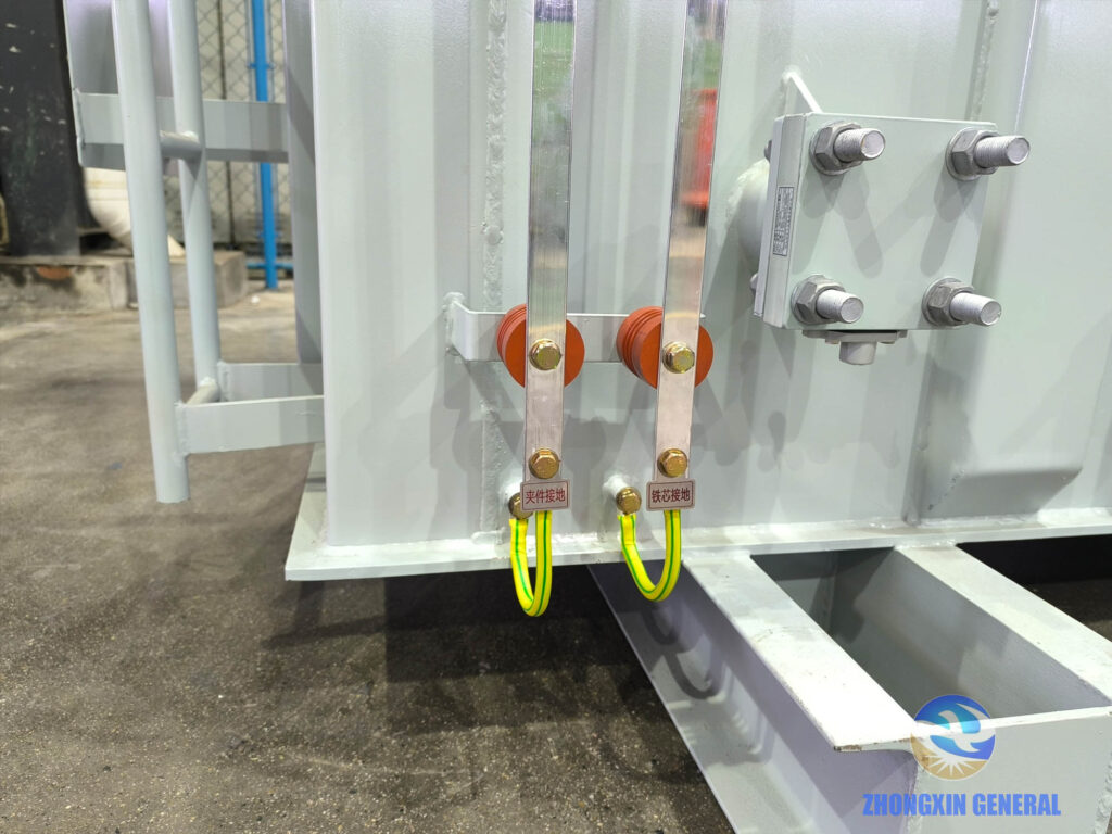 Tank-side grounding terminals marked clamp grounding and core grounding on 4000 kVA transformer
