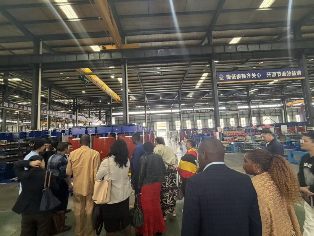 Ugandan delegation viewing the final assembly of a 5,250 kVA, 38 kV-class dry-type transformer for energy storage