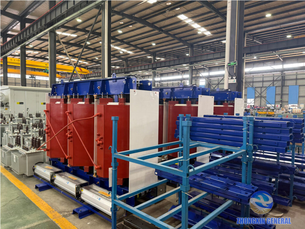 Completed 5250 kVA cast-resin dry-type transformer with cross-flow cooling fans awaiting routine factory testing