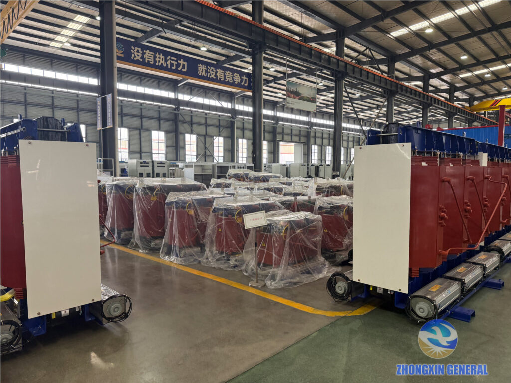 Finished cast-resin dry-type transformers plastic-wrapped in the finished-goods area ready for shipment