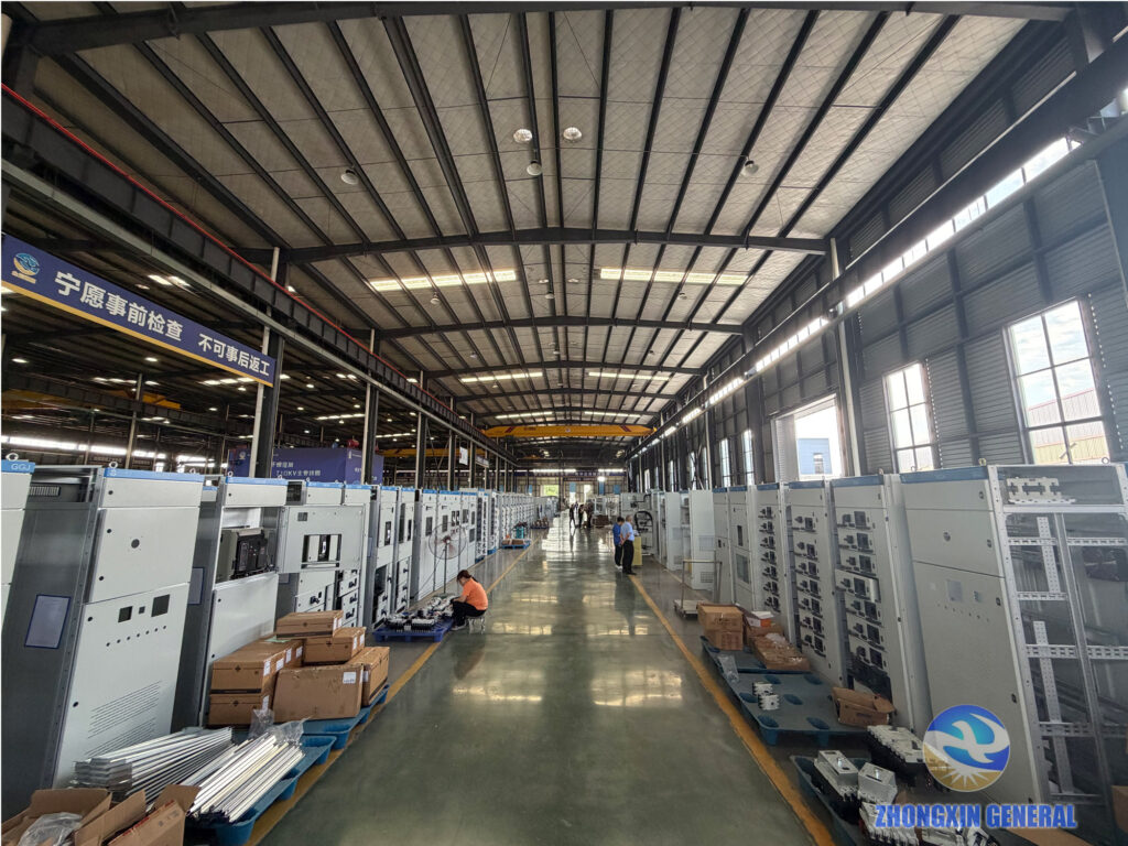 Rows of low-voltage switchgear cabinets under assembly along the ZHONGXIN GENERAL workshop line