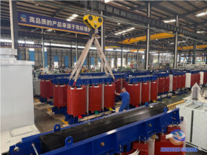 Overhead crane lifting cast-resin dry-type transformers on the ZHONGXIN GENERAL production floor during the National Day holiday