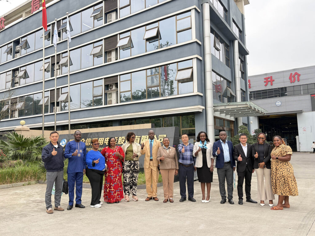 Ugandan delegation and Zhongxin General management posing together after the factory visit